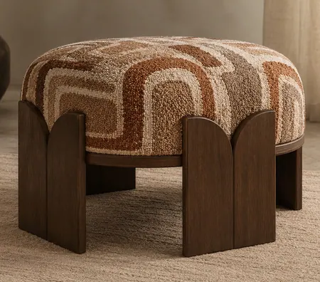 Ottoman upholstered in punch needle textile