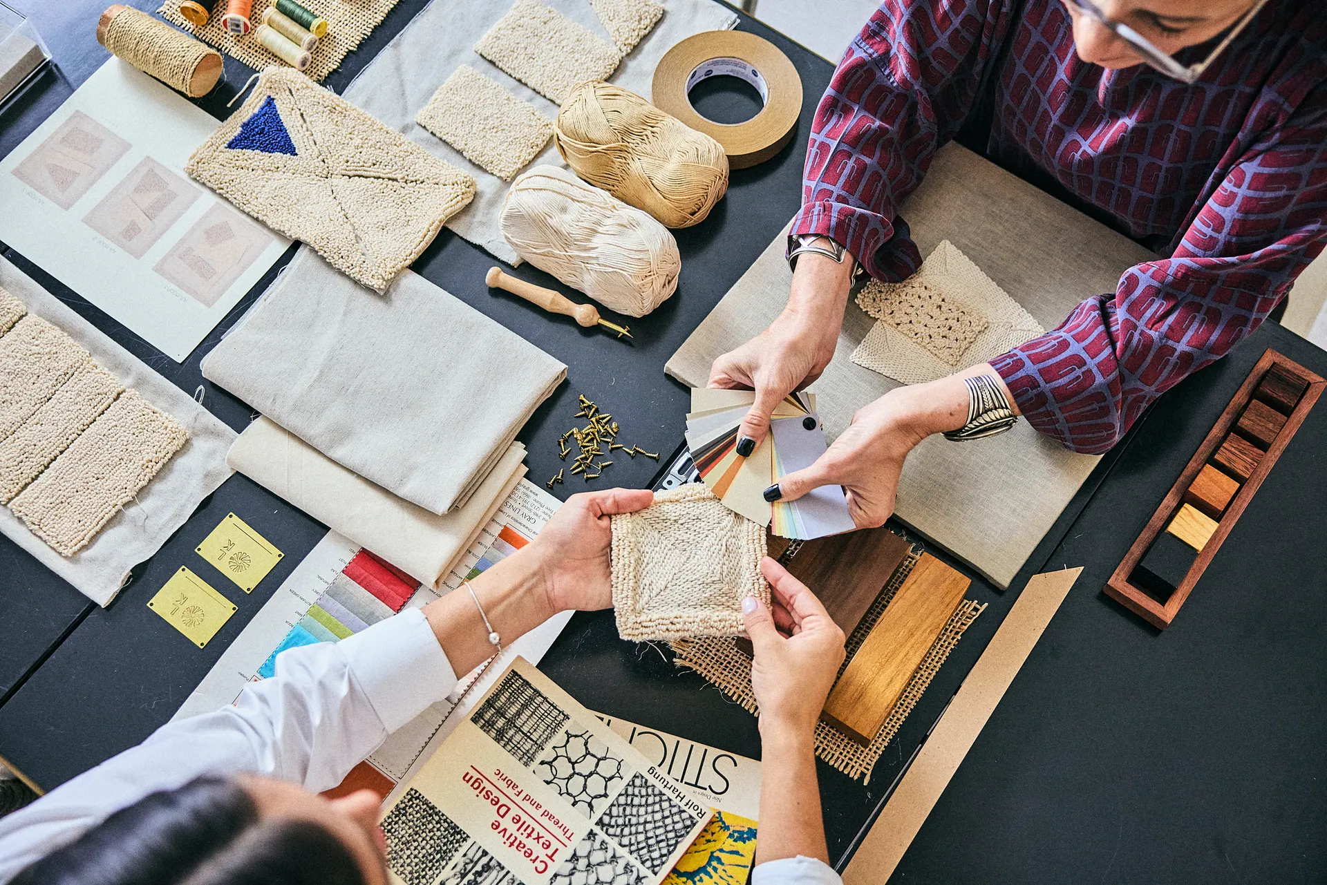 Laura Kirar studio, textile samples and swatches on the worktable